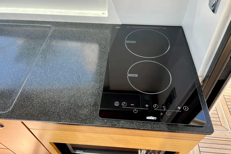 Slide: The Image of Modern induction cooktop in 2018 Nimbus 365 Coupe kitchen. - 105