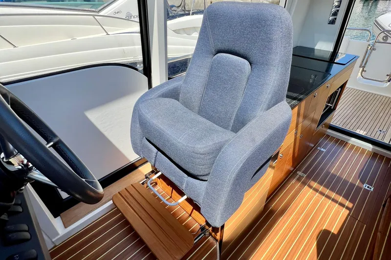 Slide: The Image of Captain's chair in 2018 Nimbus 365 Coupe, featuring sleek interior design. - 101
