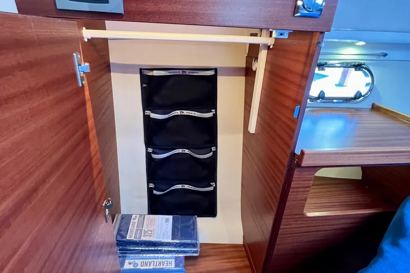 Slide: The Image of Interior of 2018 Nimbus 365 Coupe showing wooden cabinetry and storage compartments. - 134