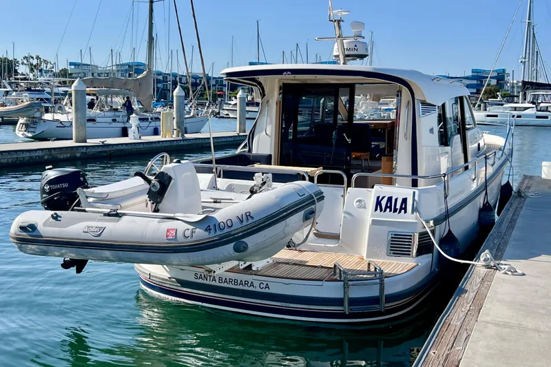 Slide: The Image of 2018 Nimbus 365 Coupe docked with inflatable boat, Santa Barbara marina. - 17