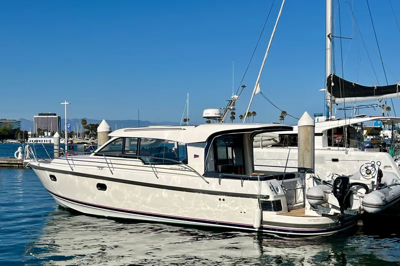 Slide: The Image of 2018 Nimbus 365 Coupe yacht docked in a sunny marina. - 20