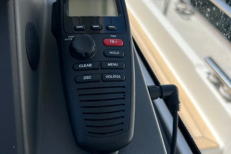 Slide: The Image of Boat radio control panel inside 2018 Nimbus 365 Coupe, featuring various function buttons. - 97