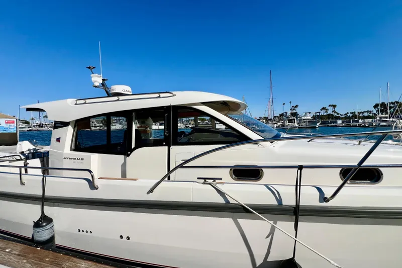 Slide: The Image of 2018 Nimbus 365 Coupe yacht docked in a sunny marina. - 10