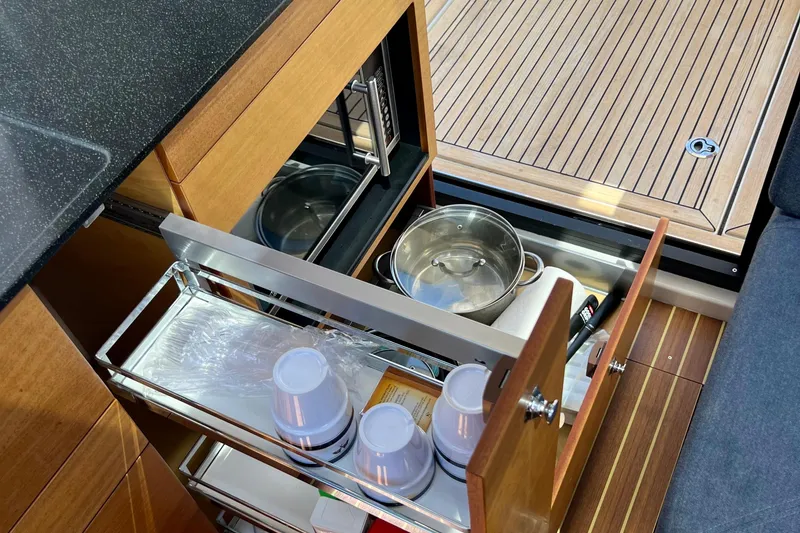 Slide: The Image of Kitchen storage in 2018 Nimbus 365 Coupe with pots and cups, wooden flooring. - 114