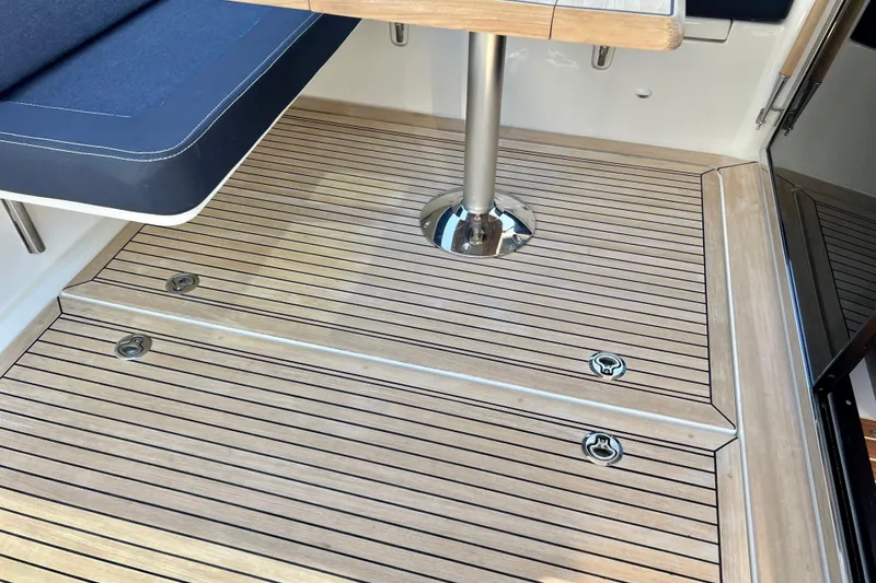 Slide: The Image of Teak deck and seating area of 2018 Nimbus 365 Coupe boat interior. - 51