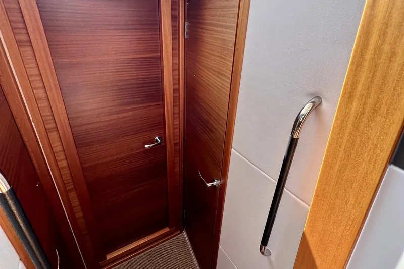 Slide: The Image of Interior of 2018 Nimbus 365 Coupe with wooden door and metal handle. - 128