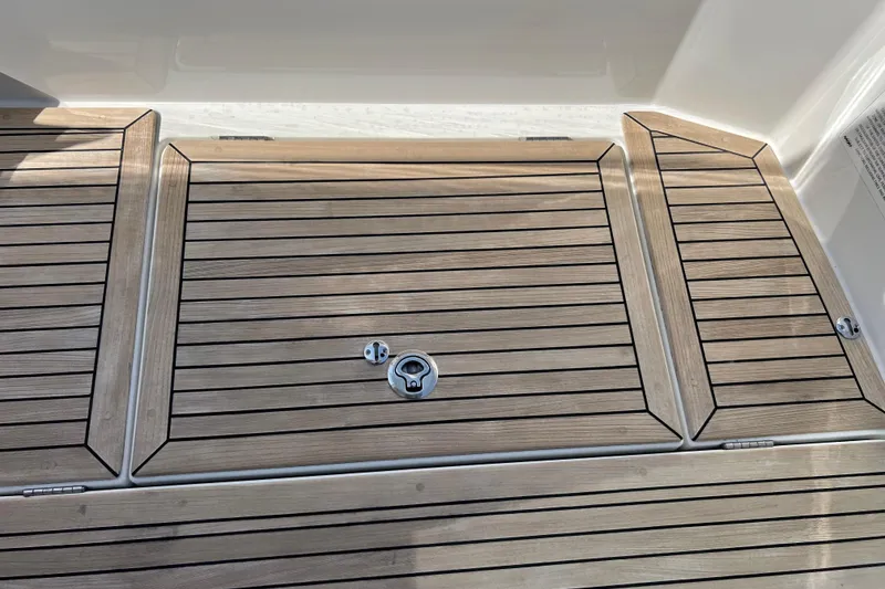 Slide: The Image of Teak deck of 2018 Nimbus 365 Coupe boat, featuring sleek wood paneling. - 49