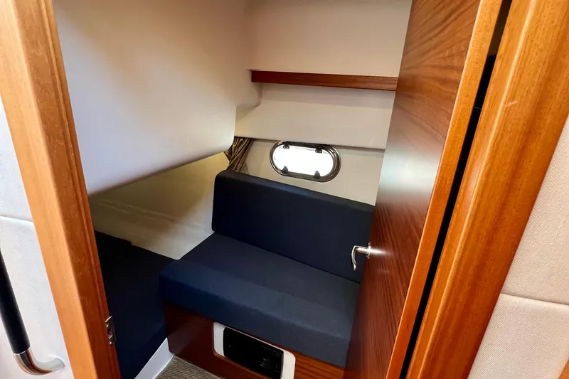 Slide: The Image of Interior cabin of 2018 Nimbus 365 Coupe with wooden finish and seating. - 146