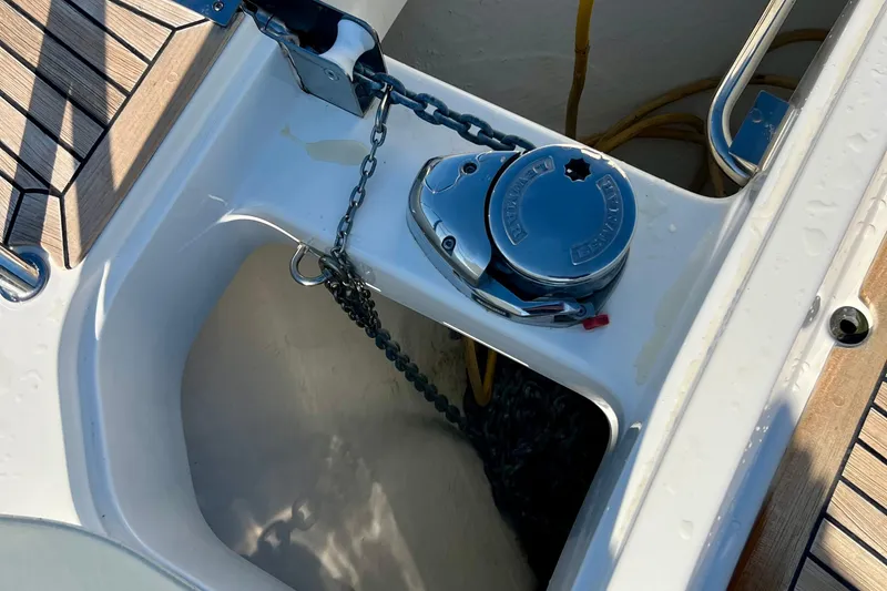 Slide: The Image of Anchor chain mechanism on 2018 Nimbus 365 Coupe boat deck. - 27