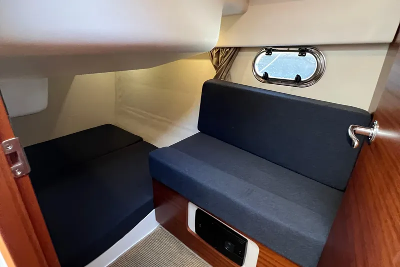 Slide: The Image of Interior cabin of 2018 Nimbus 365 Coupe with seating and porthole window. - 148
