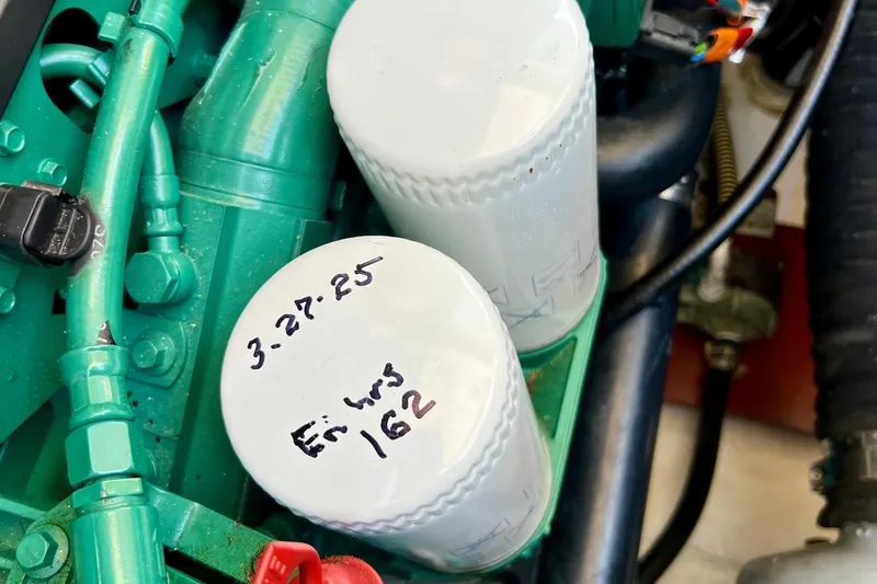 Slide: The Image of Engine compartment of 2018 Nimbus 365 Coupe with labeled oil filters. - 61