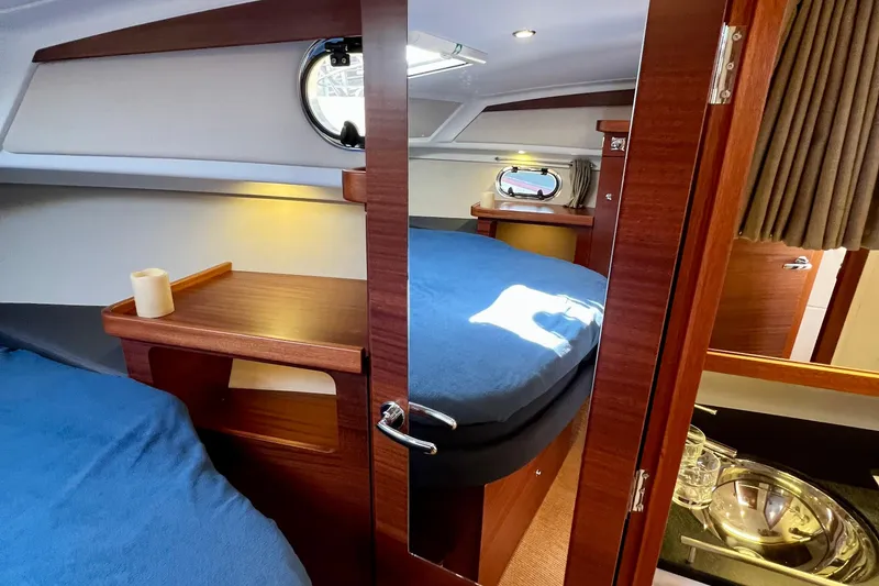 Slide: The Image of Luxurious interior of 2018 Nimbus 365 Coupe yacht with cozy cabin and wooden finishes. - 139