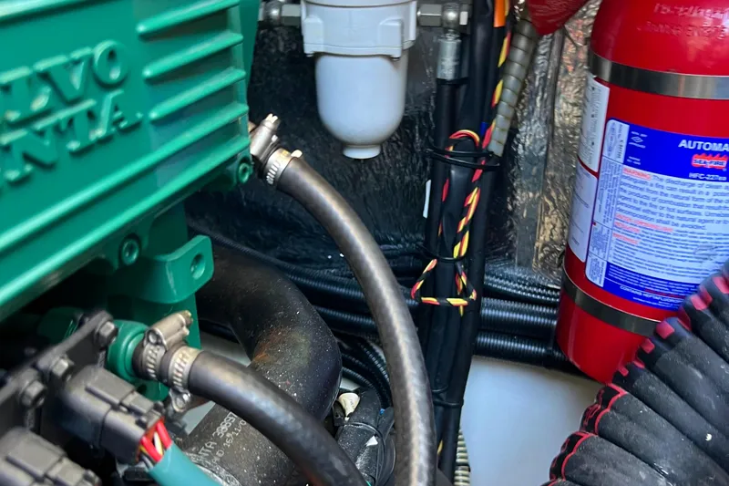 Slide: The Image of Engine compartment of 2018 Nimbus 365 Coupe with Volvo Penta engine and fire extinguisher. - 63