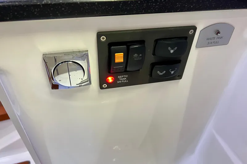 Slide: The Image of Control panel of a 2018 Nimbus 365 Coupe showing waste tank indicators. - 143