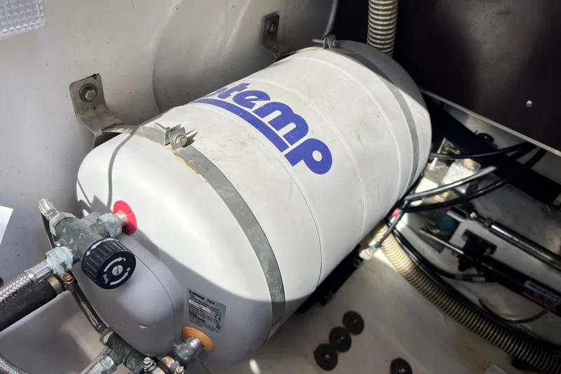 Slide: The Image of Engine compartment of 2018 Nimbus 365 Coupe with a water heater system. - 67
