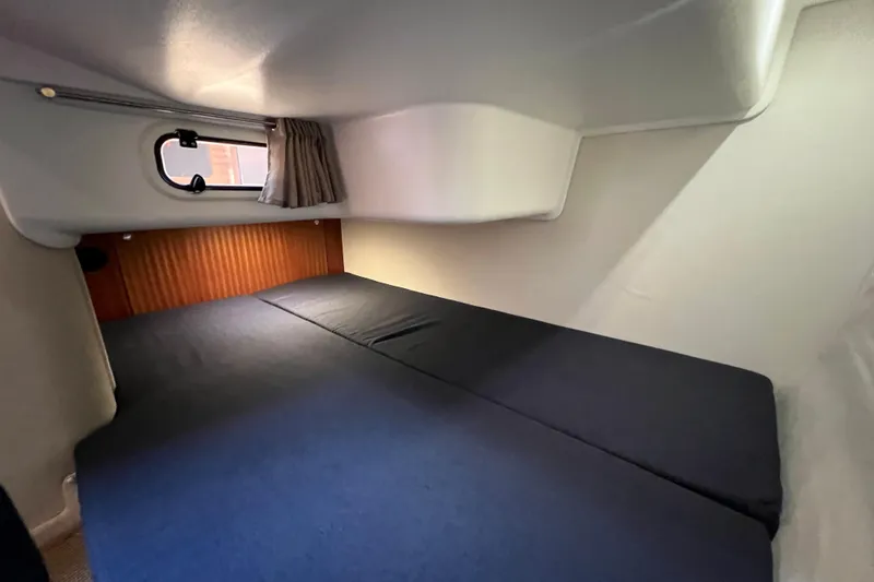 Slide: The Image of Cozy cabin interior of 2018 Nimbus 365 Coupe with bed and window. - 149