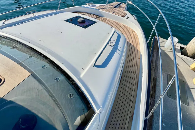 Slide: The Image of 2018 Nimbus 365 Coupe yacht deck with sleek design and wooden flooring. - 33
