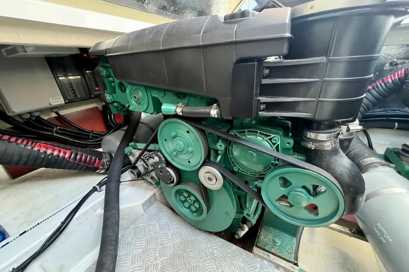 Slide: The Image of Engine compartment of a 2018 Nimbus 365 Coupe, showcasing mechanical components and belts. - 60