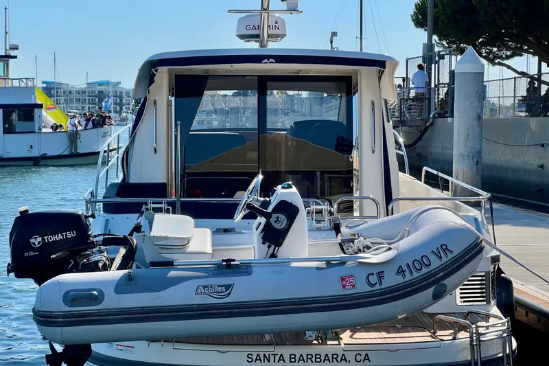 Slide: The Image of 2018 Nimbus 365 Coupe docked with inflatable boat in Santa Barbara marina. - 19