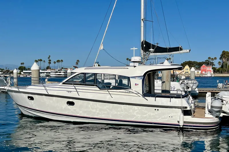 The Image of 2018 Nimbus 365 Coupe yacht docked in a sunny marina setting. - 0