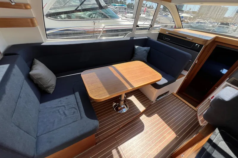 Slide: The Image of Interior of 2018 Nimbus 365 Coupe with cozy seating and wooden table. - 78