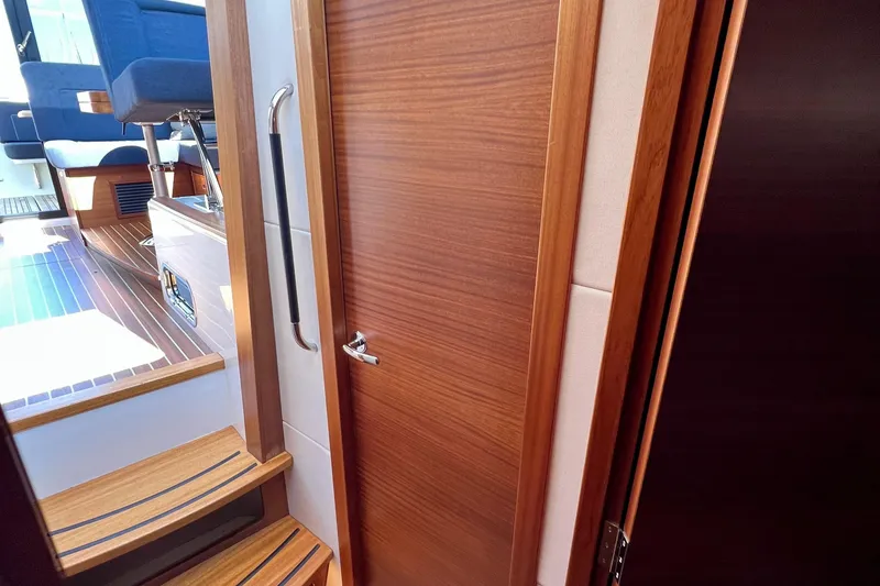 Slide: The Image of Interior of 2018 Nimbus 365 Coupe, featuring wooden door and steps. - 145
