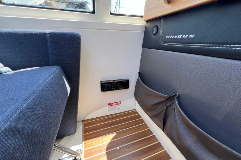 Slide: The Image of Interior of 2018 Nimbus 365 Coupe with blue seating and wood flooring. - 82