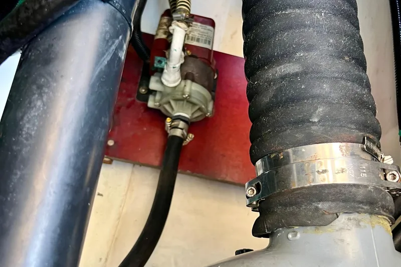Slide: The Image of Engine compartment of 2018 Nimbus 365 Coupe with visible hoses and clamps. - 66