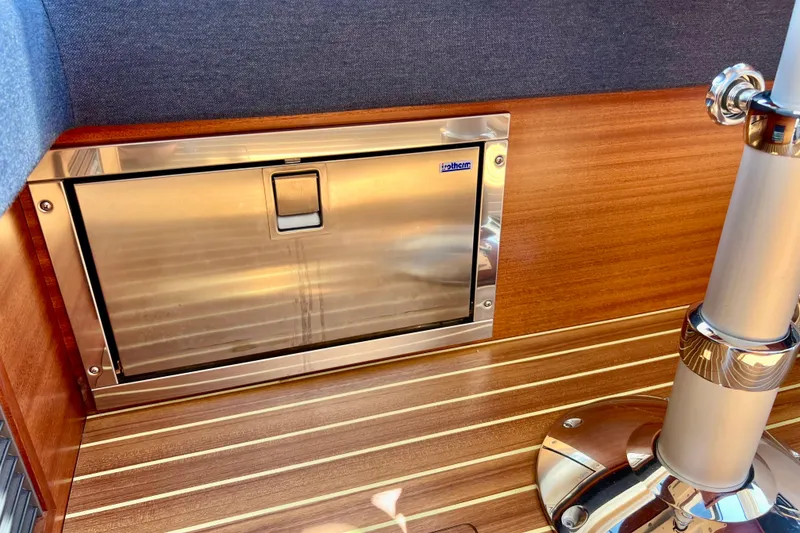 Slide: The Image of Stainless steel hatch on 2018 Nimbus 365 Coupe boat with wooden interior. - 120