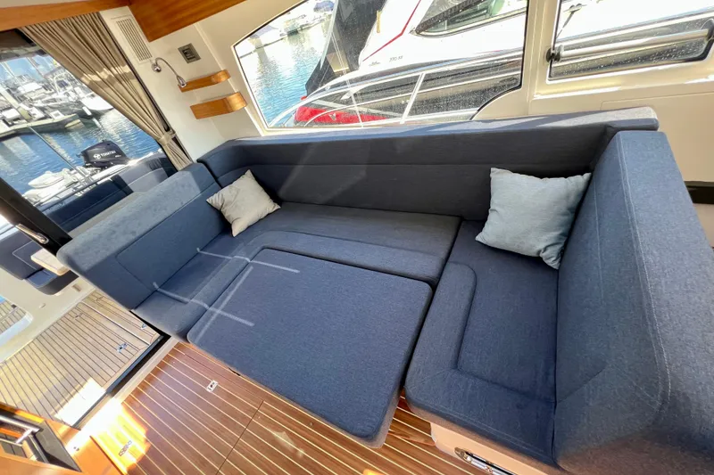 Slide: The Image of Luxurious interior of 2018 Nimbus 365 Coupe with blue seating and wooden flooring. - 74
