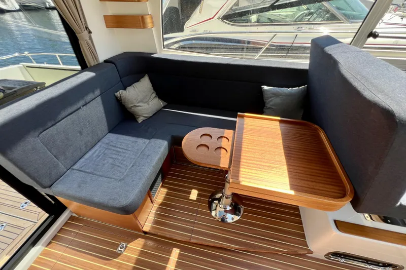 Slide: The Image of Interior of 2018 Nimbus 365 Coupe with cozy seating and wooden table. - 72