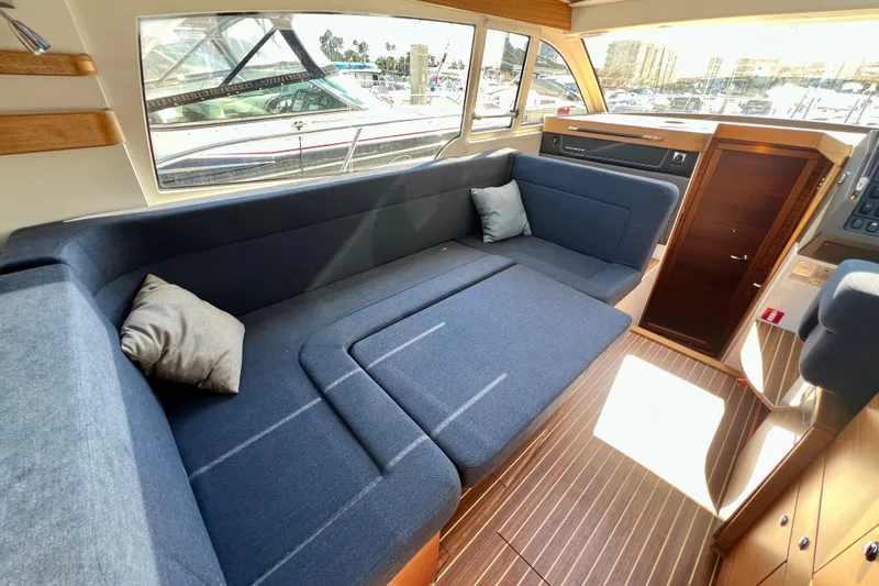 Slide: The Image of Interior of 2018 Nimbus 365 Coupe with blue seating and wooden accents. - 75