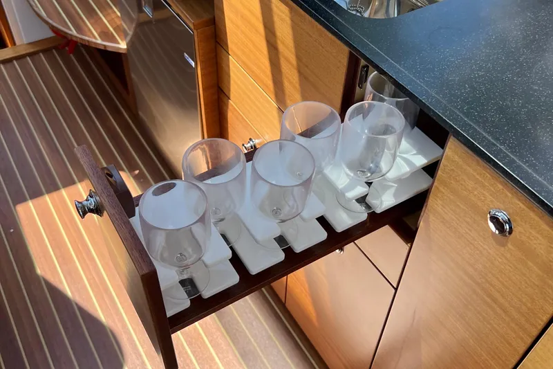 Slide: The Image of Drawer with wine glasses in 2018 Nimbus 365 Coupe yacht interior. - 115