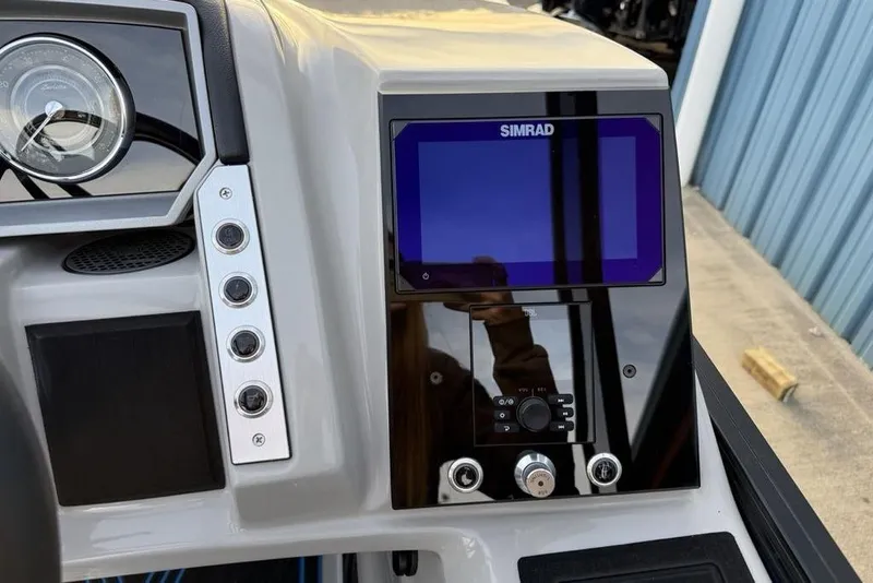 Slide: The Image of Dashboard of 2025 Barletta 23UC boat with Simrad display and controls. - 19
