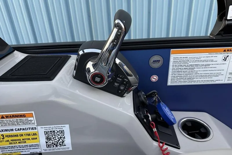 Slide: The Image of Control panel of 2025 Barletta 23UC boat with throttle and warning labels. - 20