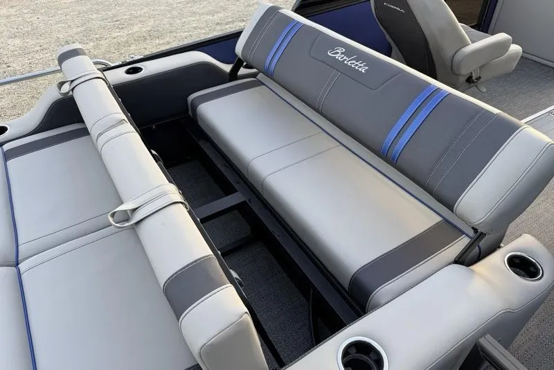 Slide: The Image of 2025 Barletta 23UC boat interior with gray and blue cushioned seating. - 25