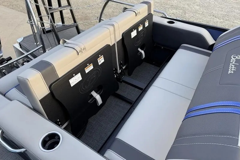 Slide: The Image of 2025 Barletta 23UC boat interior with gray seating and cup holders. - 27
