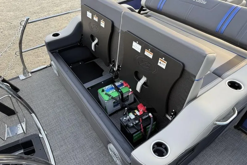 Slide: The Image of 2025 Barletta 23UC boat interior with battery storage and seating area. - 28