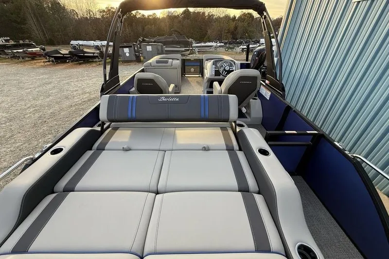 Slide: The Image of 2025 Barletta 23UC boat interior with luxurious seating and modern dashboard. - 30
