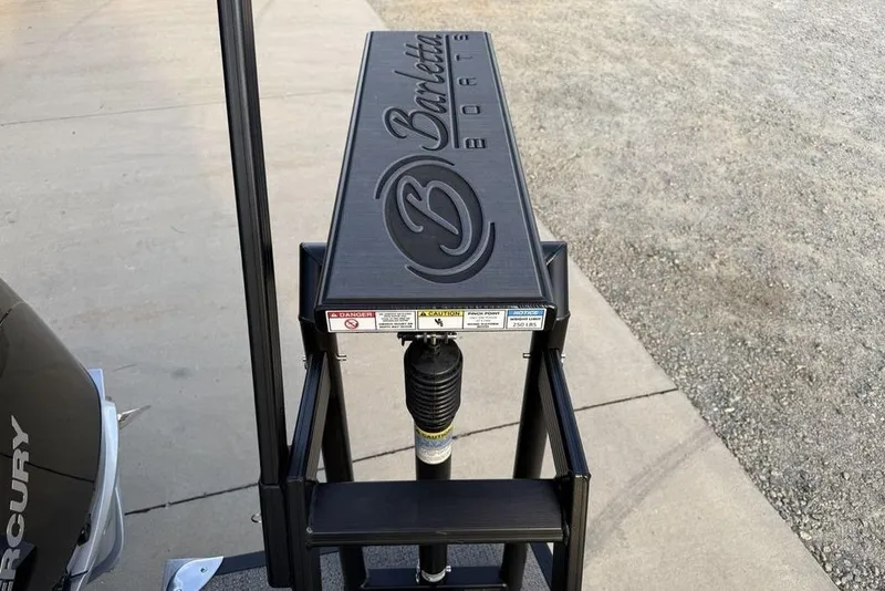 Slide: The Image of Barletta 23UC 2025 boat detail with logo and Mercury engine visible. - 32