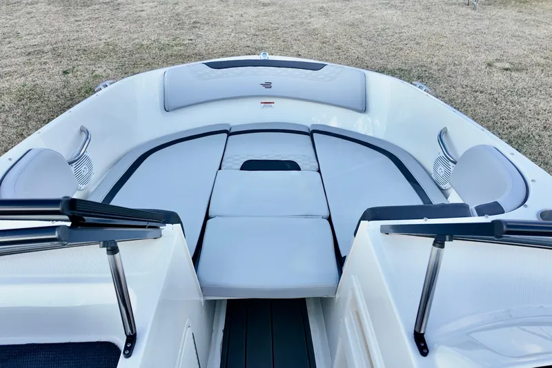 Slide: The Image of 2026 Bayliner Element M19 boat interior with cushioned seating and sleek design. - 10