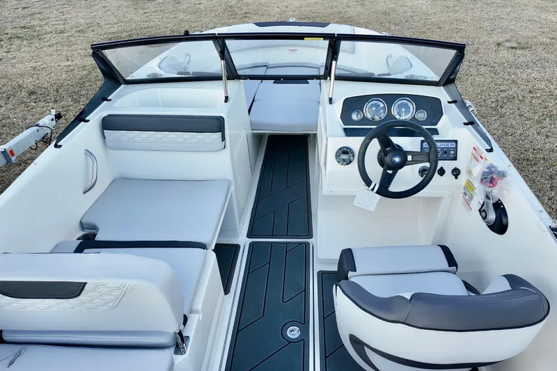 Slide: The Image of 2026 Bayliner Element M19 boat interior with modern dashboard and seating. - 8
