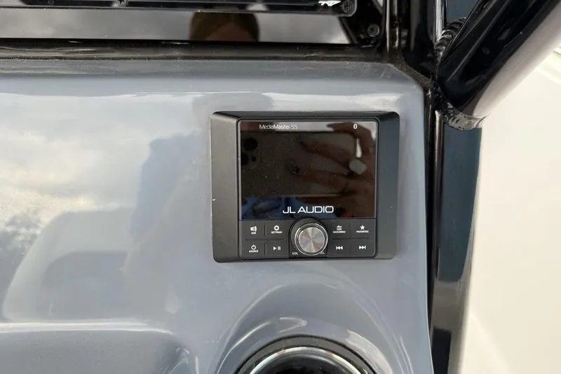 Slide: The Image of JL Audio system on 2026 Tidewater 232 CC Adventure boat dashboard. - 18