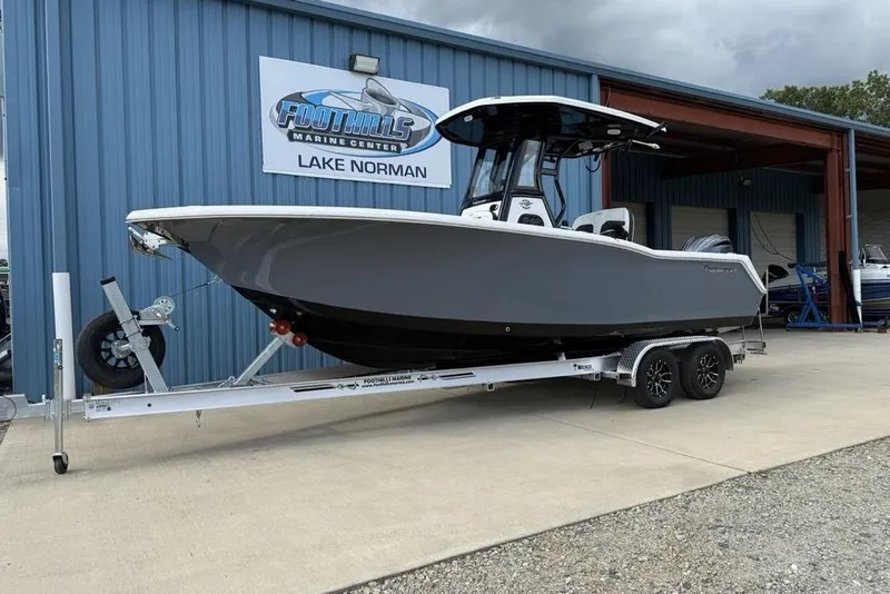 Slide: The Image of 2026 Tidewater 232 CC Adventure boat on trailer at Foothills Marine Center. - 3