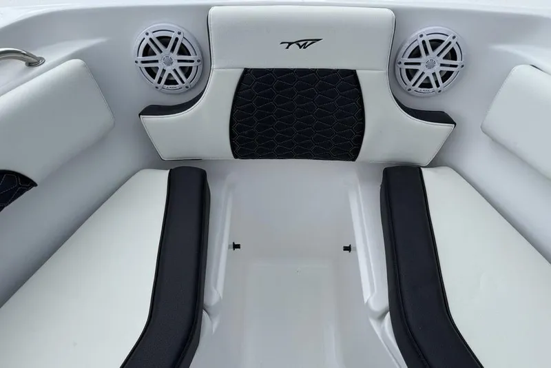 Slide: The Image of 2026 Tidewater 232 CC Adventure boat interior with cushioned seating and speakers. - 7