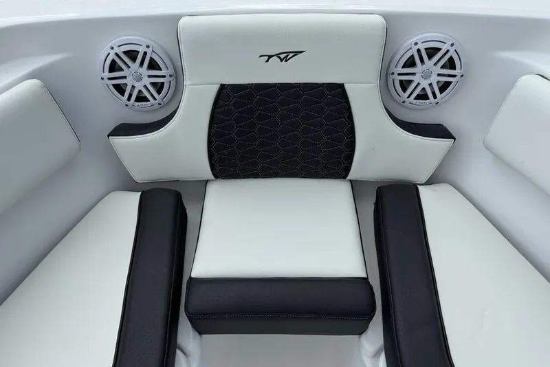 Slide: The Image of 2026 Tidewater 232 CC Adventure boat interior with cushioned seating and built-in speakers. - 9