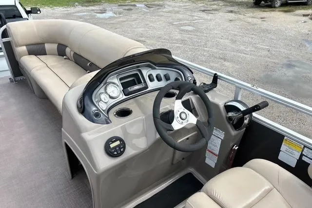 Slide: The Image of 2021 Sun Tracker Party Barge 20 DLX interior with steering console and seating. - 10