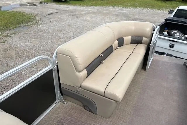 Slide: The Image of 2021 Sun Tracker Party Barge 20 DLX with beige seating on a pontoon boat. - 11