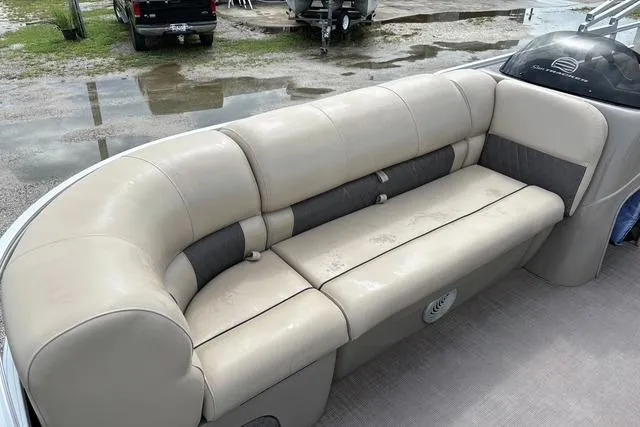 Slide: The Image of 2021 Sun Tracker Party Barge 20 DLX pontoon boat with beige seating and spacious interior. - 13