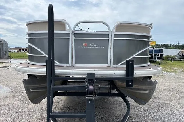 Slide: The Image of 2021 Sun Tracker Party Barge 20 DLX pontoon boat on trailer, parked outdoors. - 7